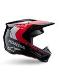 Casco Honda S-M5, casco da motocross, nero e rosso lucido con dettagli bianchi e argento, vista laterale con loghi Honda e Alpinestars, design aerodinamico con visiera e molteplici prese d'aria, equipaggiamento protettivo professionale per fuoristrada