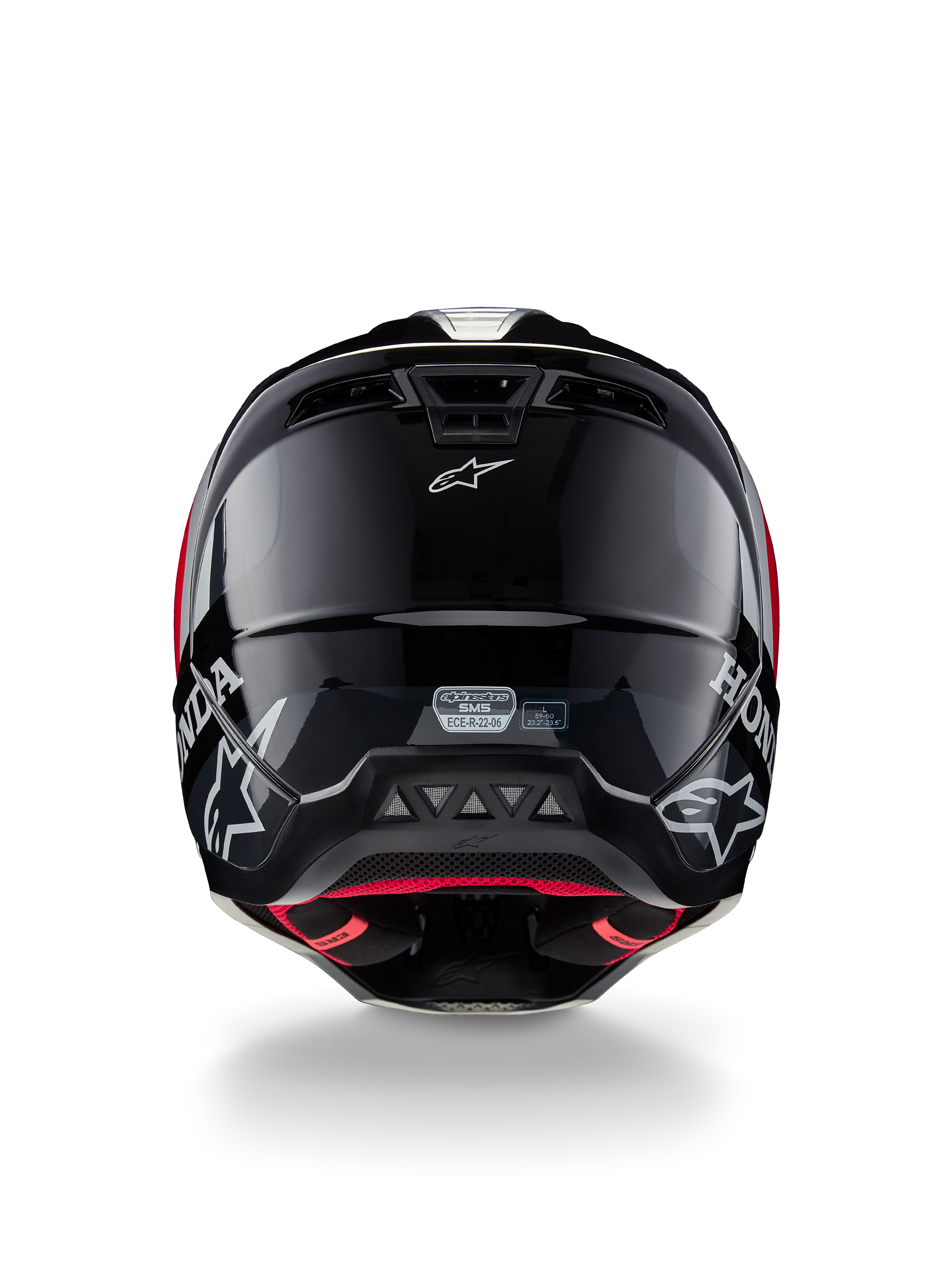 Casco Alpinestars Honda S-M5 ECE, casco da motocross, nero rosso lucido, vista posteriore che mostra la calotta nera lucida con loghi Honda e Alpinestars bianchi, fodera interna rossa e etichetta di certificazione di sicurezza ECE