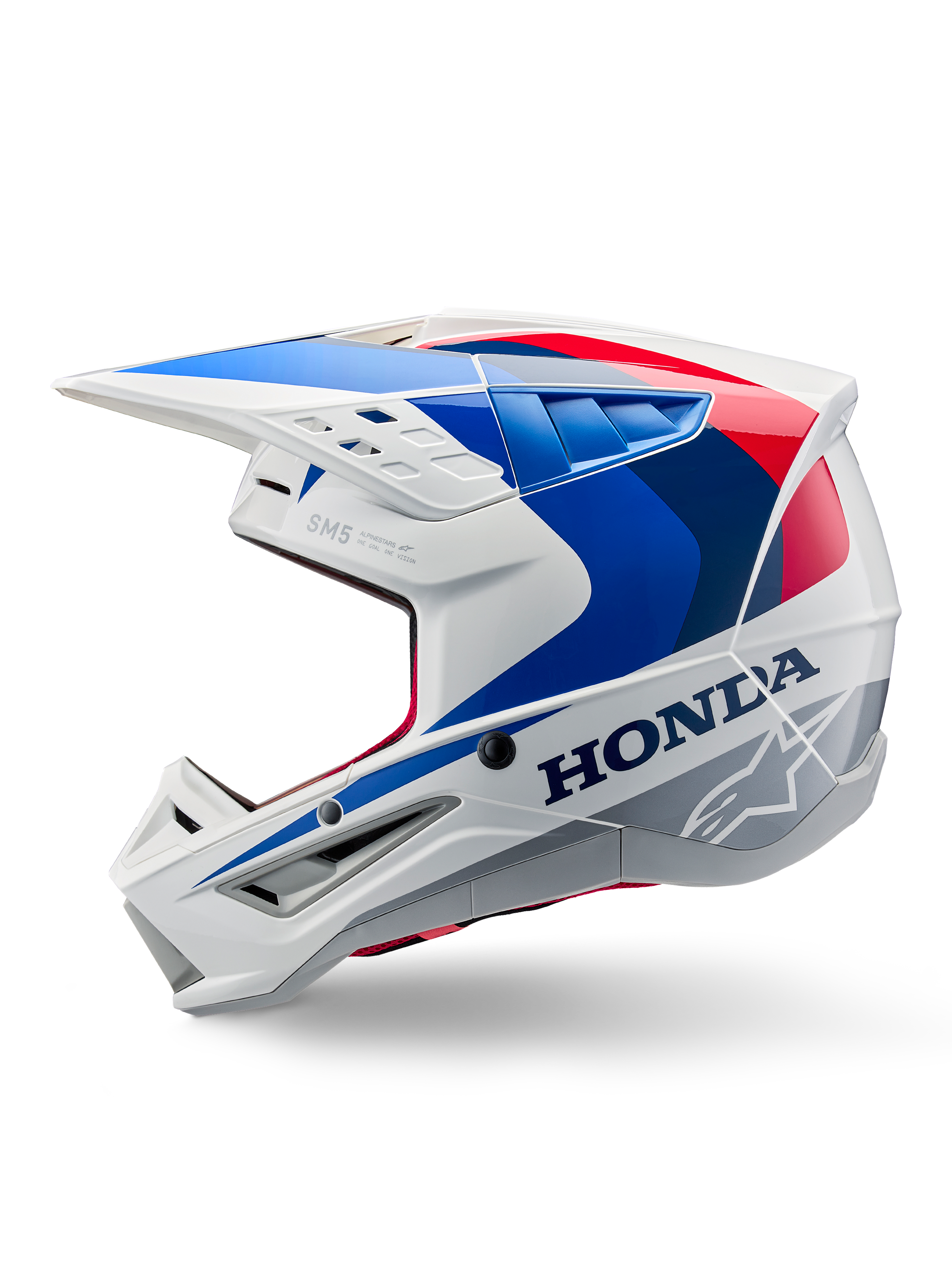 Casco Alpinestars Honda S-M5 ECE, bianco blu rosso lucido, vista laterale di profilo, con branding Honda e logo a stella Alpinestars, design aerodinamico da motocross con prese d'aria multiple e frontino prominente, finitura lucida