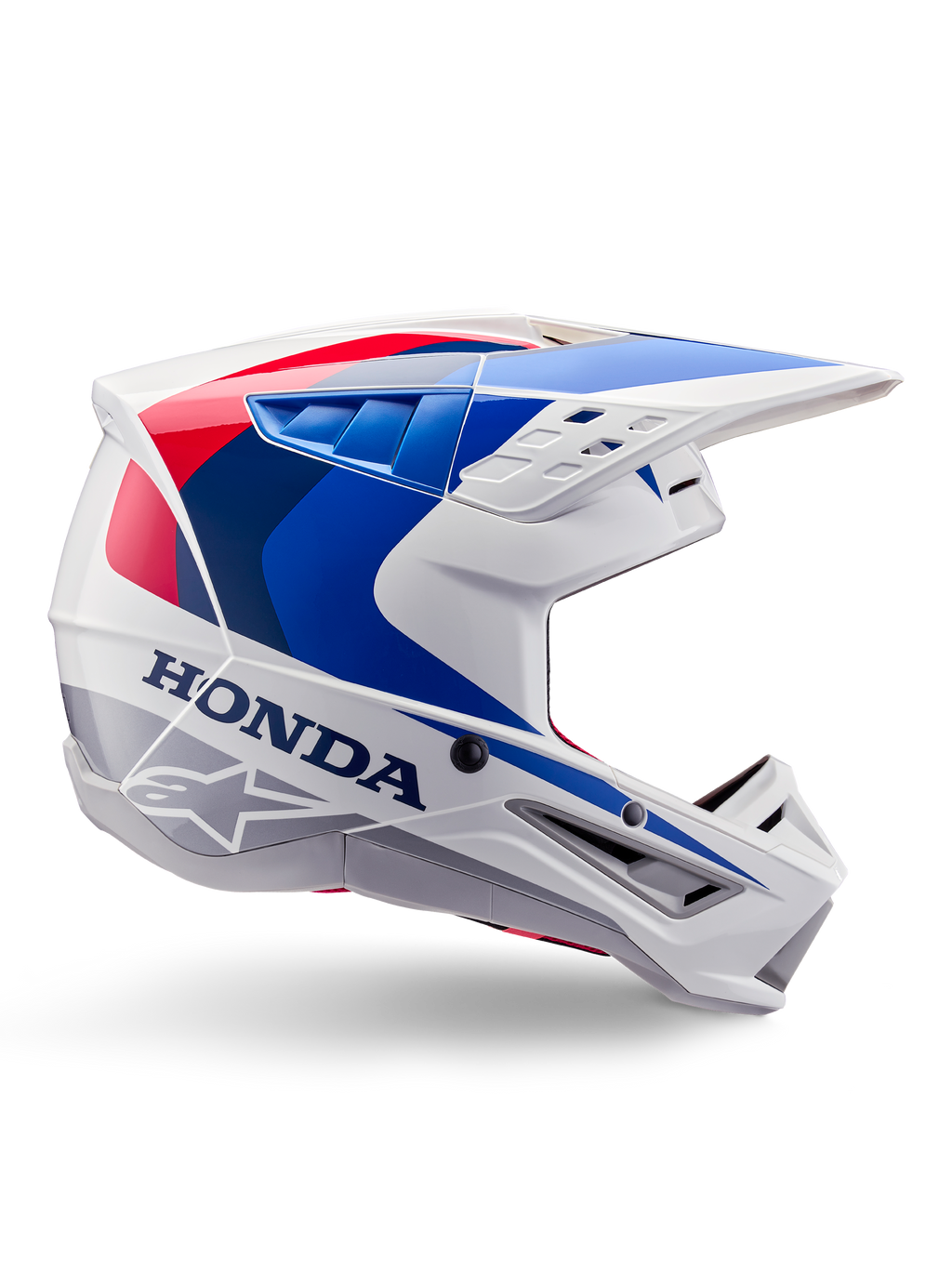 Alpinestars Honda S-M5 Helmet ECE, casco da motocross, bianco, blu e rosso, vista di profilo laterale, design aerodinamico con visiera integrata, molteplici aperture di ventilazione, finitura lucida, marchio Honda in evidenza e logo Alpinestars