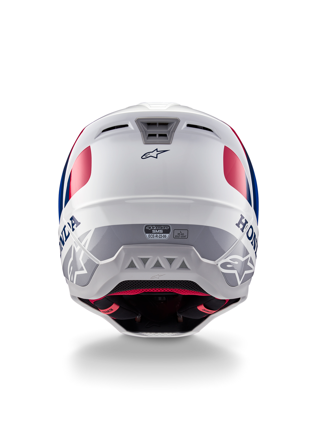 Casco Alpinestars Honda S-M5 ECE, casco da motocross, bianco, blu e rosso lucido, vista posteriore con marchi Honda e Alpinestars, calotta aerodinamica con prese d'aria integrate ed etichetta di certificazione ECE.