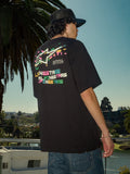 Alpinestars Wild Oversized CSF Tee, t-shirt a maniche corte, nero, logo Astars multicolore vivace sul retro, vestibilità oversize, scatto lifestyle streetwear casual con palme