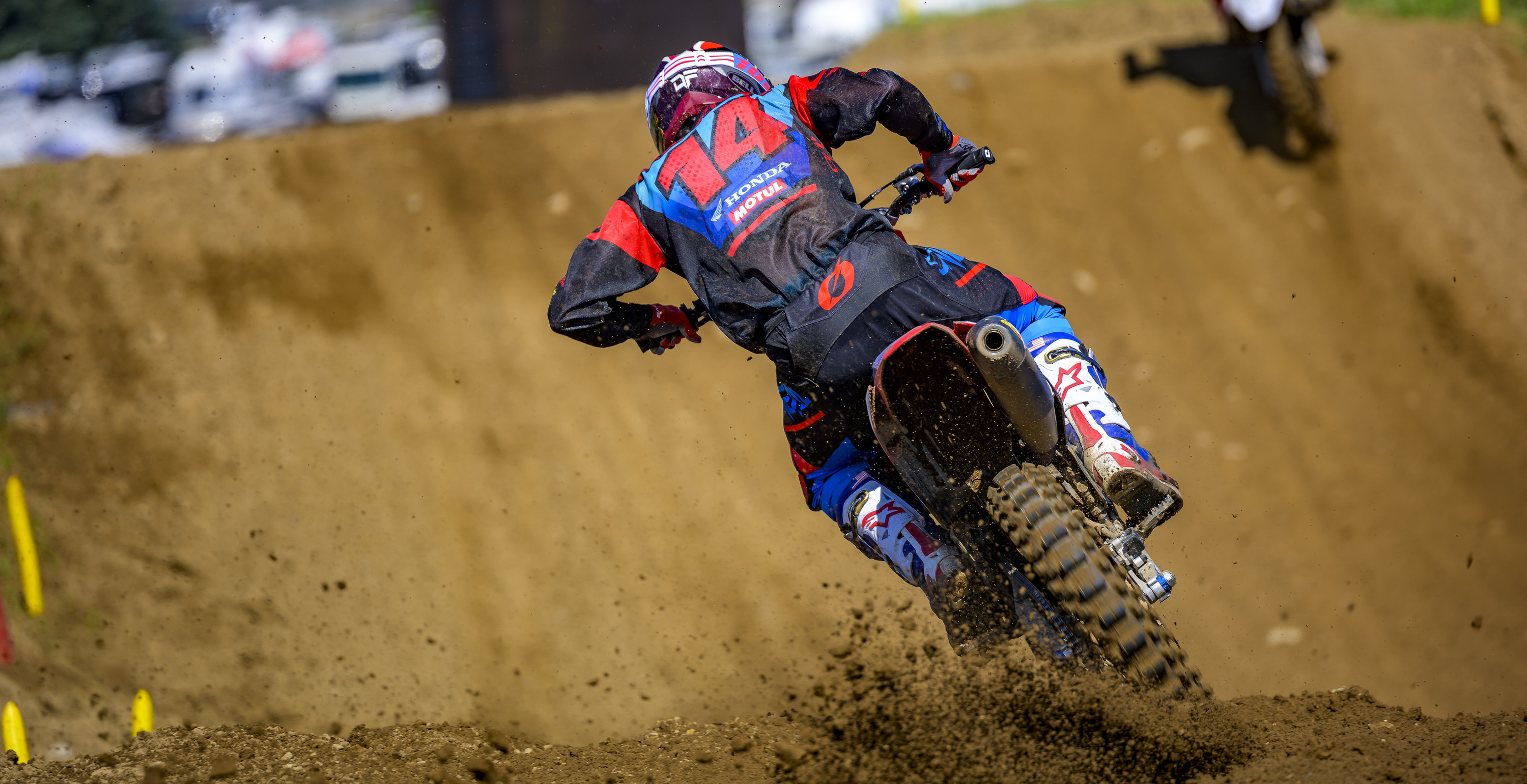 Dylan Ferrandis in action on a dirt track with number 14 and Alpinestars logos visible