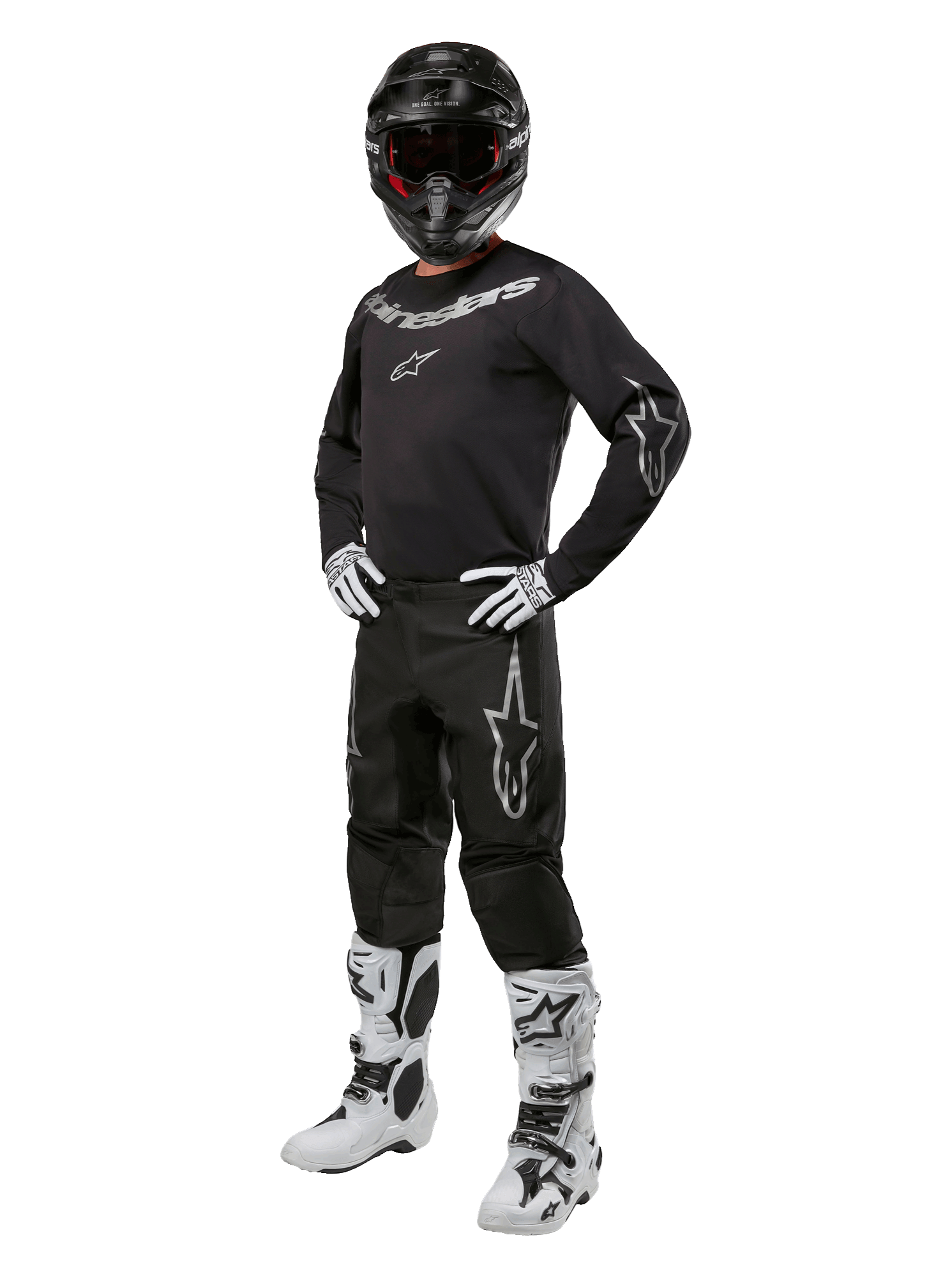 Alpinestars 2024 Fluid Graphite Gear Set, completo motocross nero con loghi grigi e bianchi, maglia e pantaloni abbinati a casco nero coordinato, guanti e stivali bianchi e neri, equipaggiamento protettivo per fuoristrada