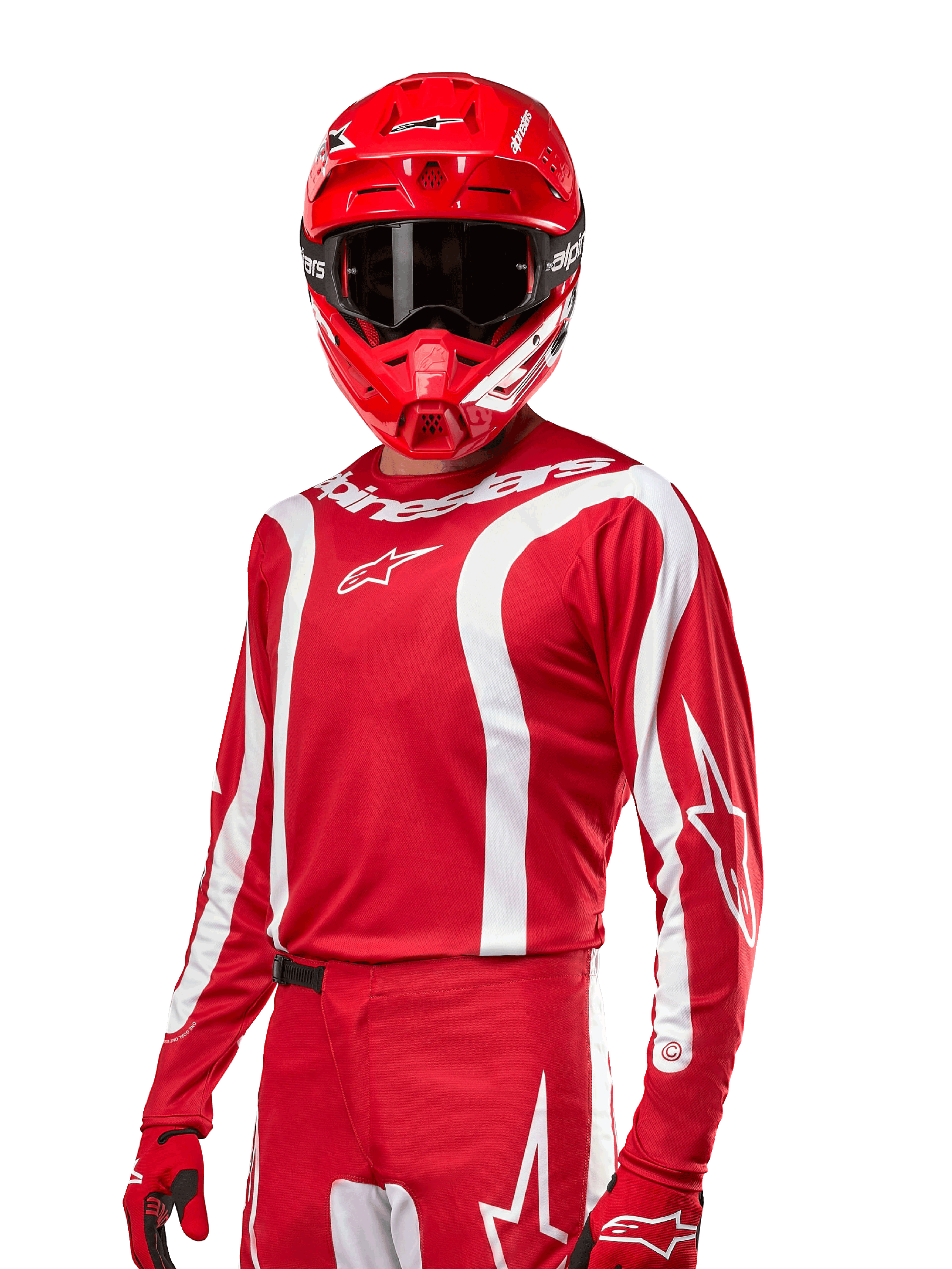 Alpinestars Maglia Fluid Lurv 2024, maglia da motocross, rosso Mars e bianco, indossata con casco e guanti coordinati, design sportivo audace con strisce curve bianche e marchio Alpinestars