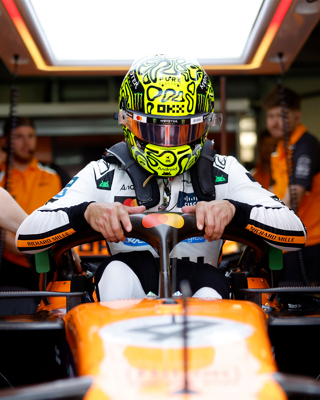 Lando Norris about to sit and drive his McLaren F1 Car