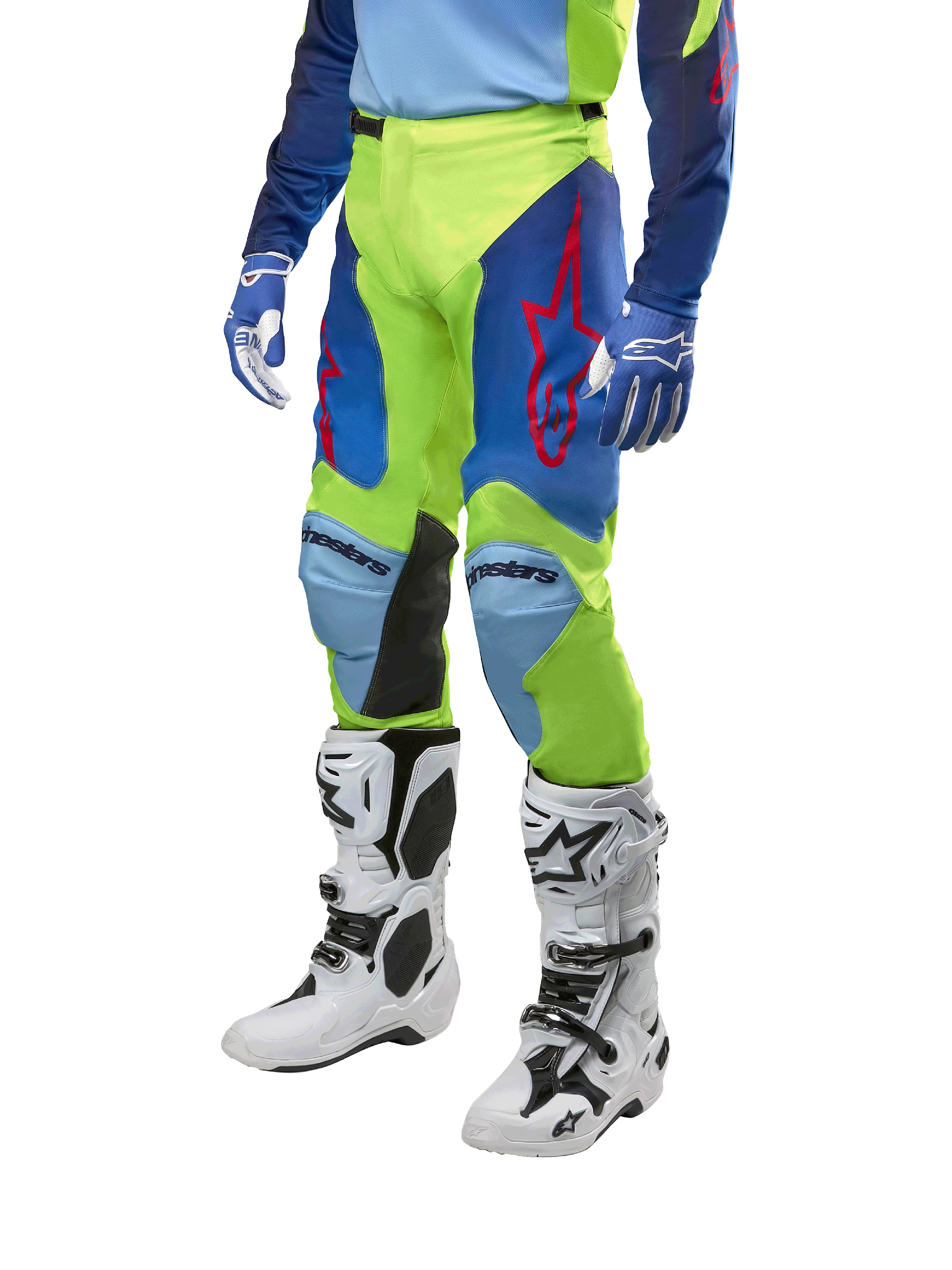 Pantaloni Alpinestars Racer Hoen 2024, pantaloni da motocross, giallo fluo e blu notte con loghi a stella rossi e pannelli interni neri alle ginocchia, indossati con maglia coordinata e stivali da motocross bianchi, abbigliamento tecnico per gare off-road