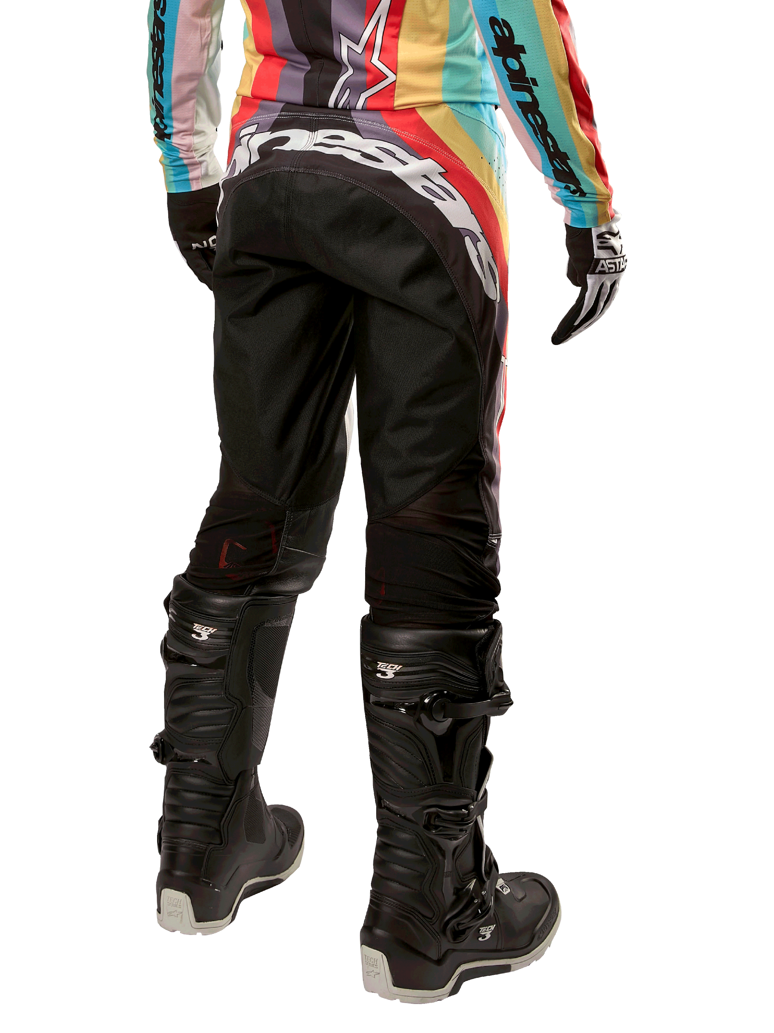 Alpinestars Pantaloni Stella Techstar 2024 da donna, pantaloni da motocross, nero multicolore, vista posteriore con vistoso marchio bianco sulla seduta, indossati con stivali Tech 3 neri e maglia multicolore coordinata, abbigliamento professionale per corse fuoristrada.