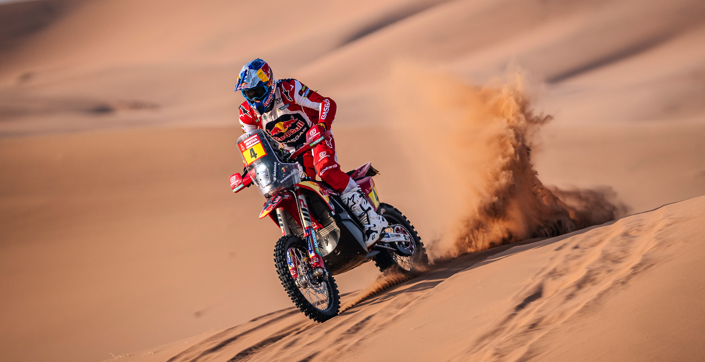 Sam Sunderland riding in the desert wearing Alpinestars enduro apparel and protections