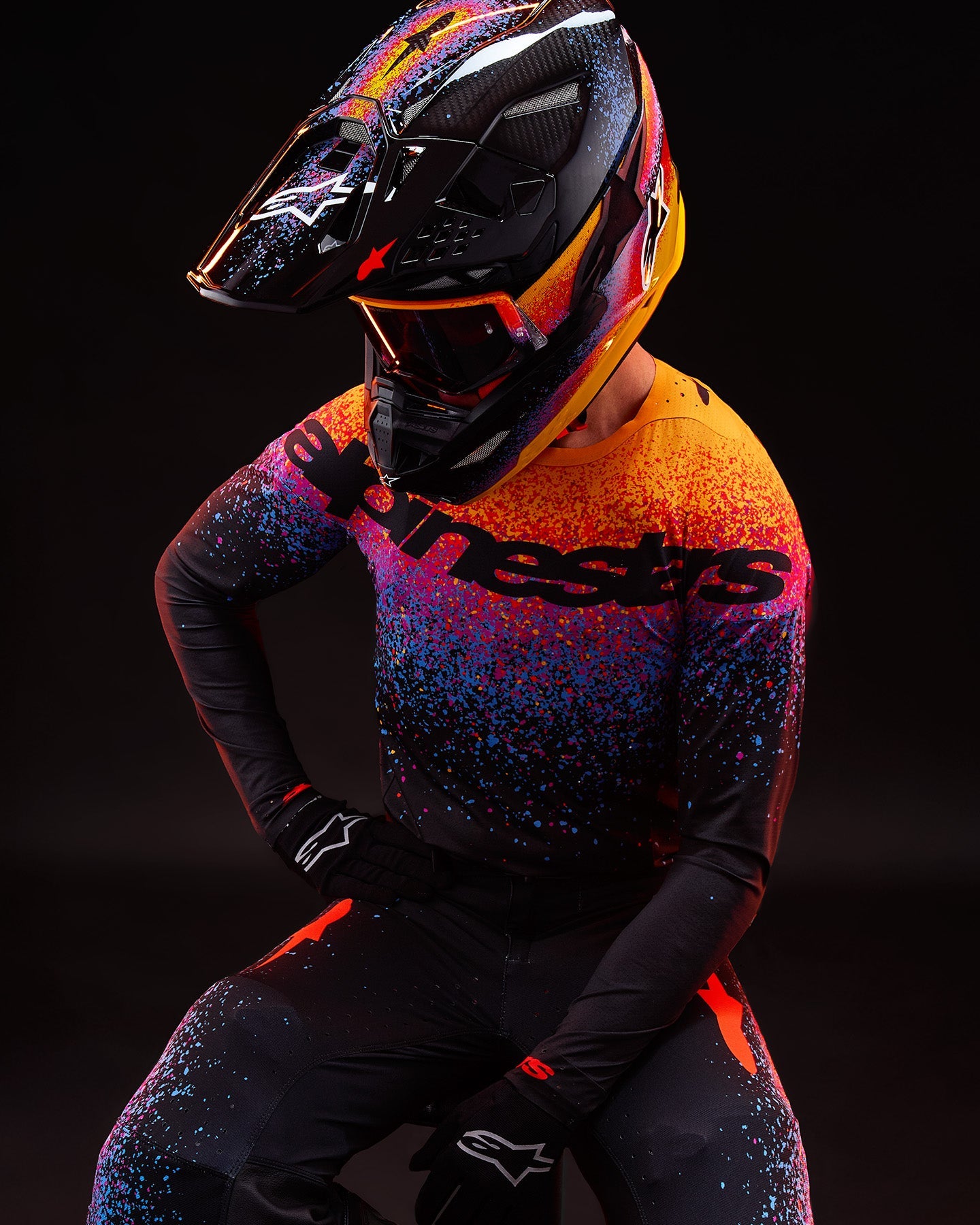 Alpinestars Limited Edition Supertech Black Hole Goggles and M10 Helmet, Motocross, Black with orange and purple splatter.