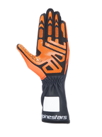 Guanti da kart Alpinestars Tech-1 K V3, nero e arancione, vista del palmo con motivo grip in silicone dettagliato, polsino lungo con logo Alpinestars bianco, design ergonomico per gare di kart