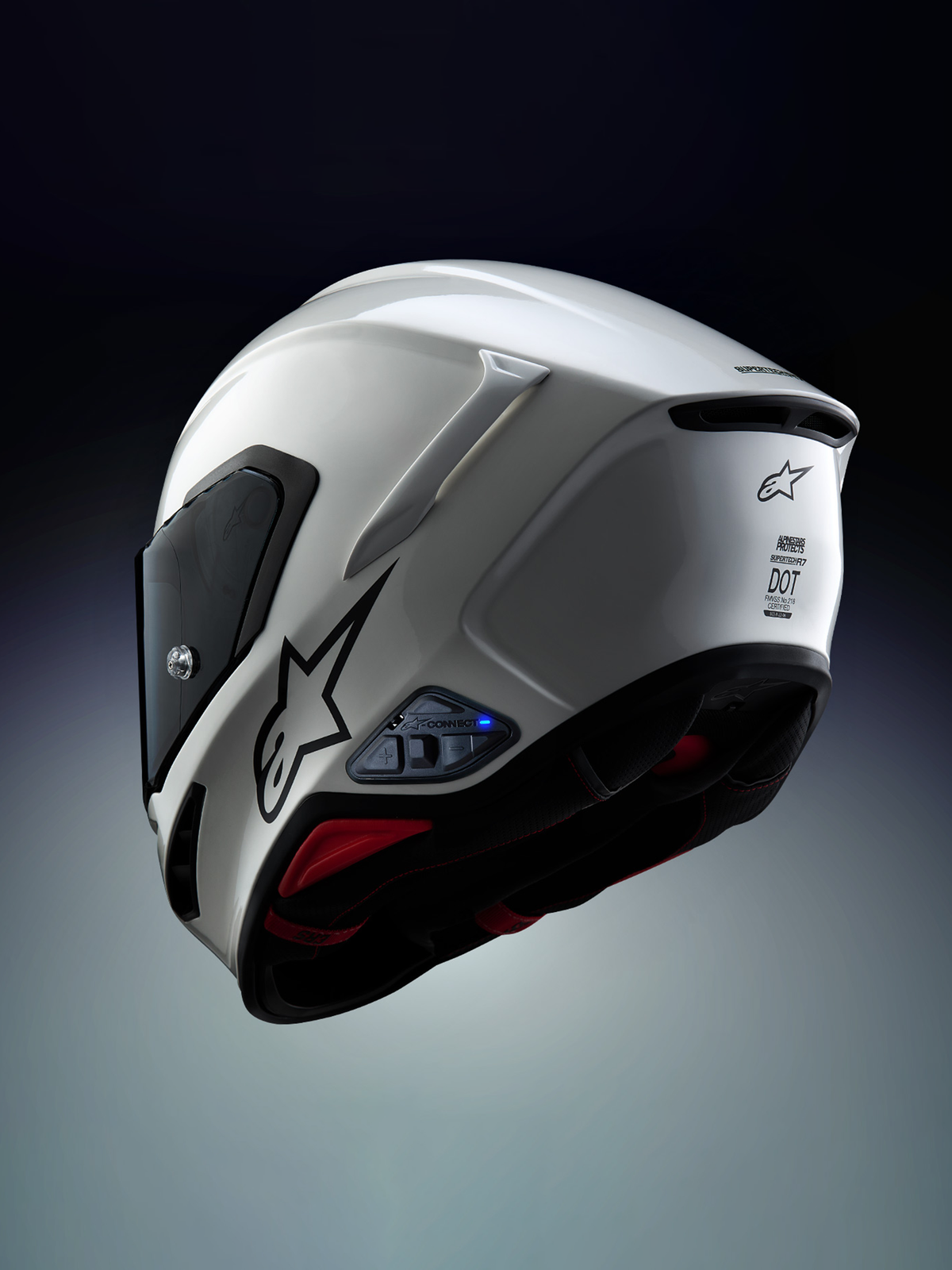 Alpinestars A-Connect Communication System installato su un casco moto Alpinestars S-R7, bianco e nero, con interfono Mesh e centralina Bluetooth con LED di stato blu