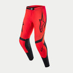 Pantaloni Alpinestars Supertech Ember LE, pantaloni da motocross, rosso fluo e rosso acceso con accenti neri, grandi loghi Alpinestars sulle cosce, zone traforate per la ventilazione e pannelli neri sull'interno gamba e sugli stinchi, abbigliamento ad alte prestazioni per corse fuoristrada.