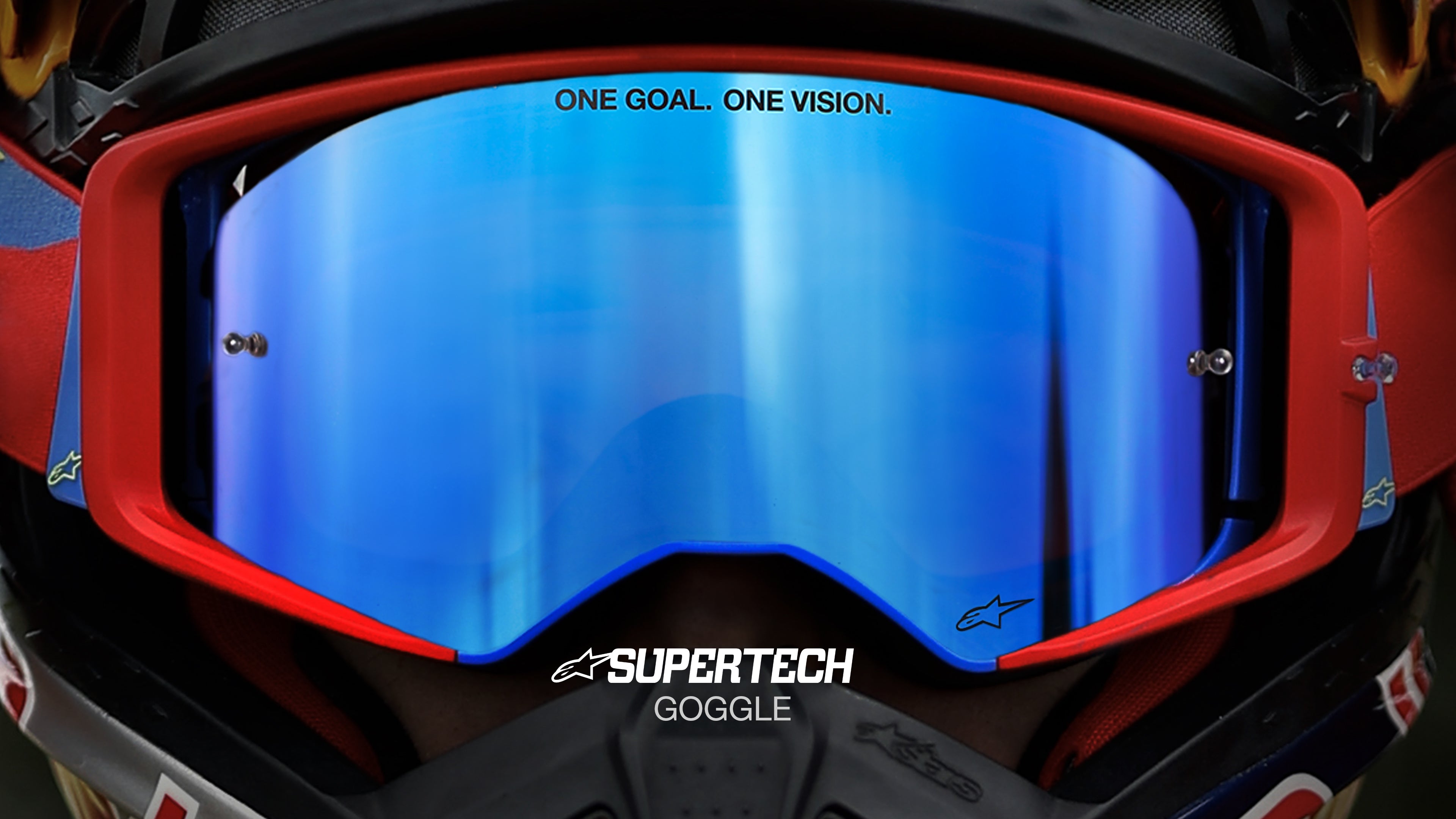Alpinestars Supertech Goggle, motocross racing eyewear with red frame and reflective blue mirror lens.