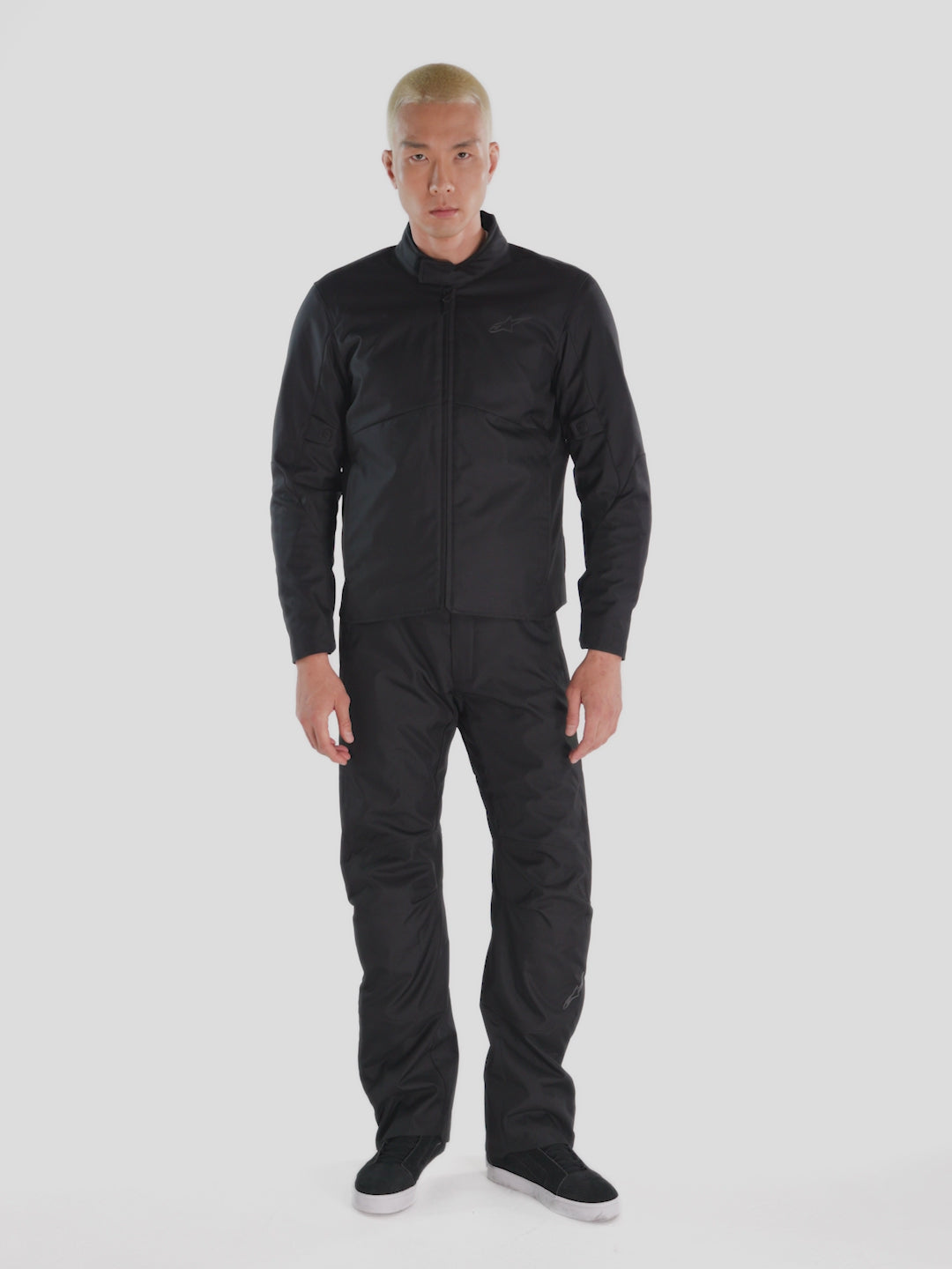 Alpinestars C-1 Waterproof Pants, men's urban contemporary motorcycle riding pants in black, textile construction featuring pocket and pocket details worn by a model.