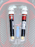 Alpinestars Tech-Air 7X & Off-Road Replacement Canister Kit, bombole di ricambio per airbag, nere con estremità bianche e bande arancioni, due bombole di argon installate in un sistema airbag elettronico con trama a nido d'ape rossa e nera e cablaggi colorati